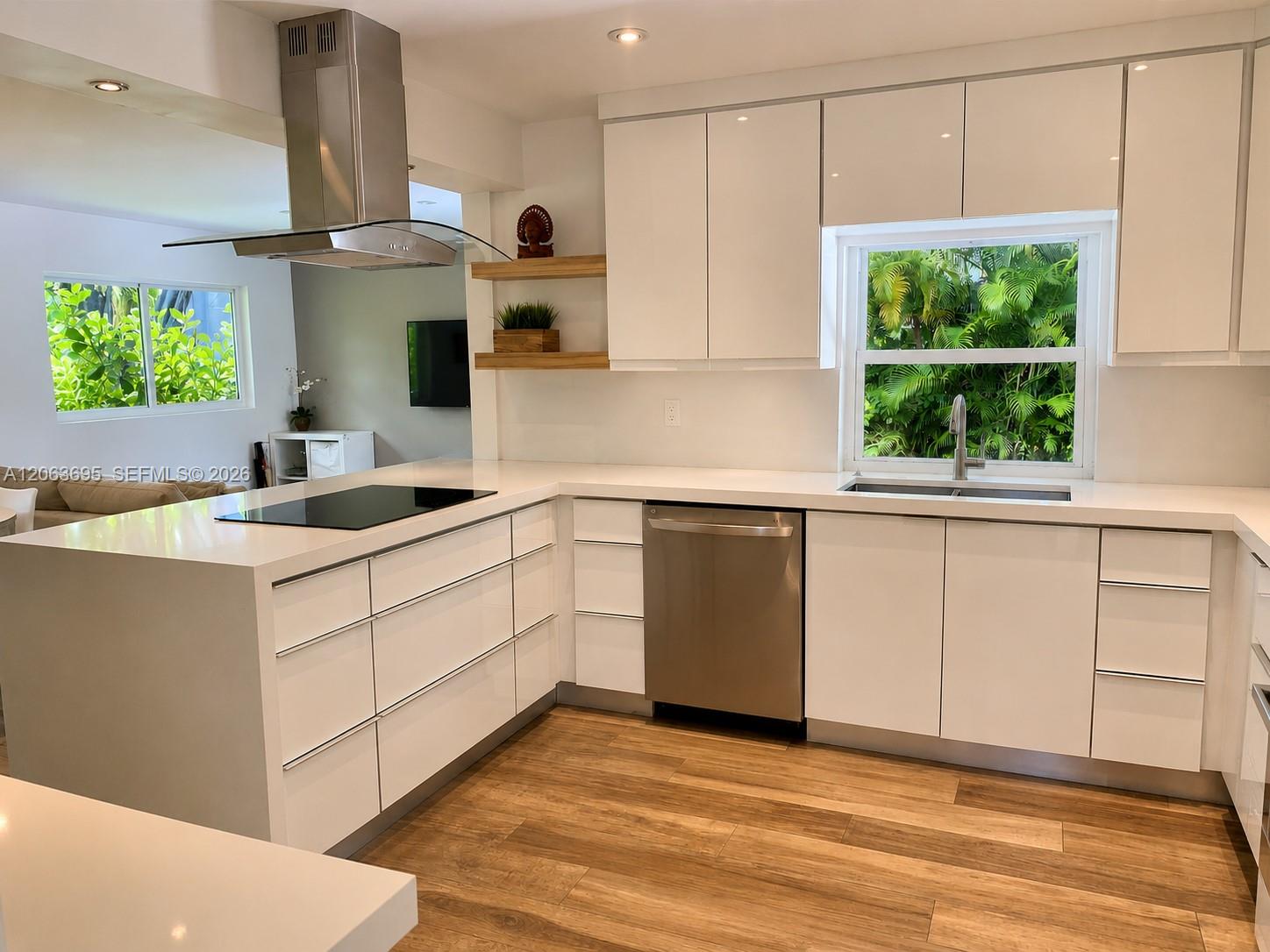 Kitchen with new stainless steel appliance, induction cooktop