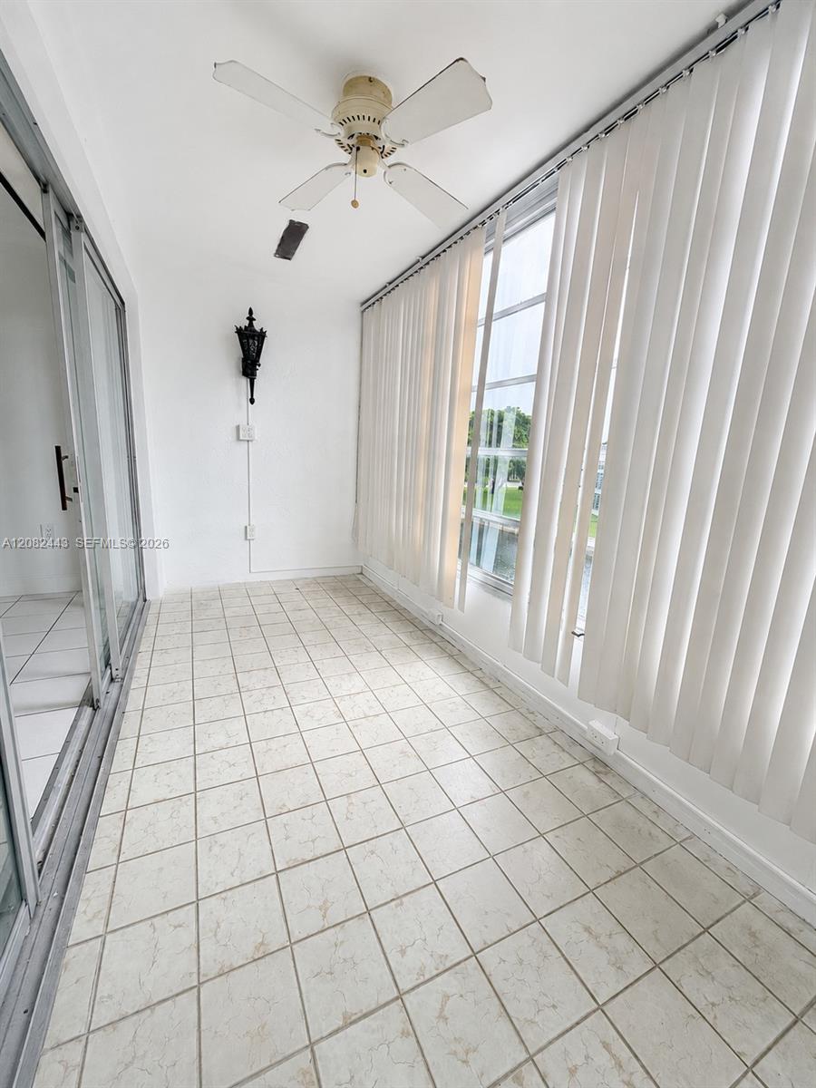 Spacious enclosed screened balcony.
