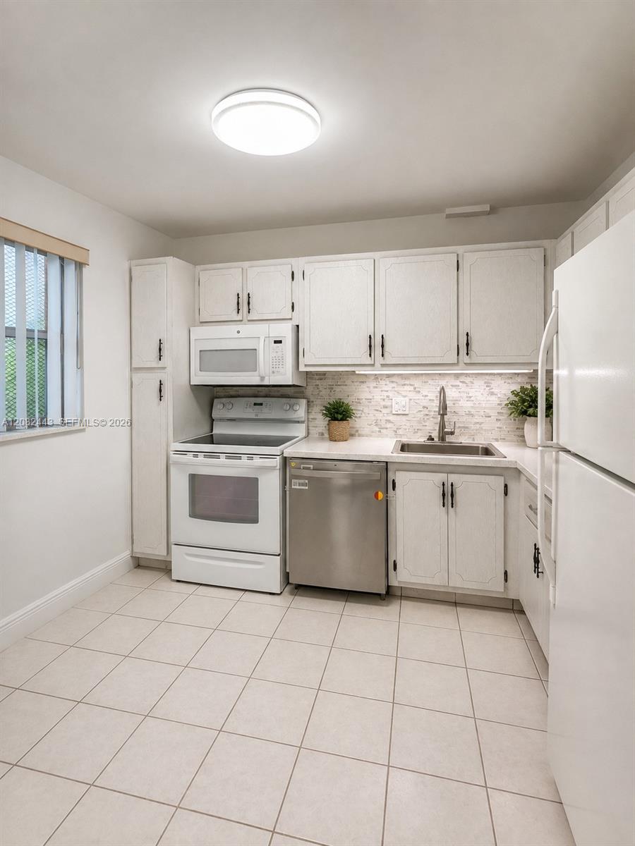 Bright kitchen with ample cabinet space.