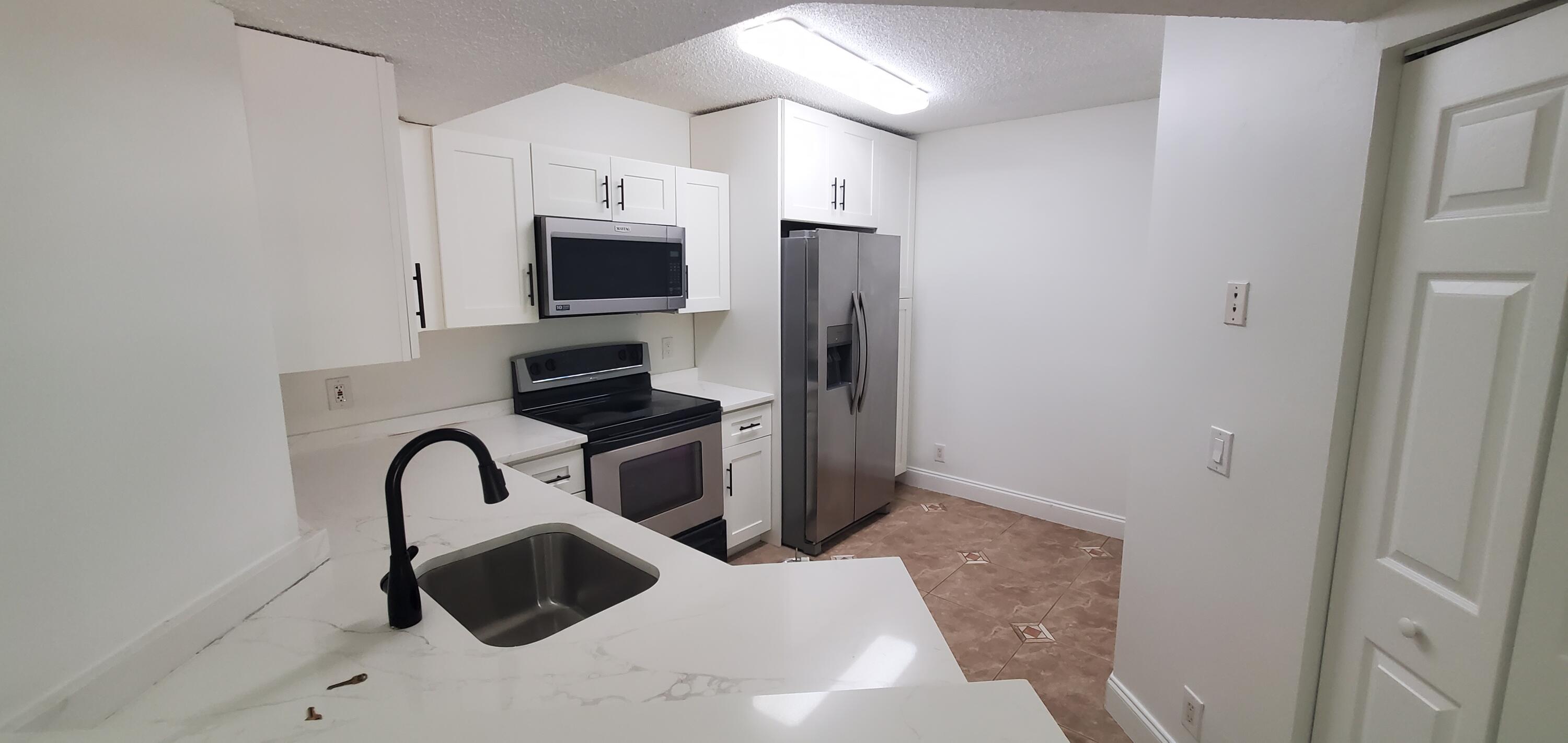8721 WILES Road # 302 — Photo 3
