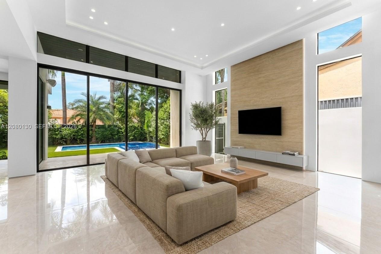 Living Room. Disclaimer: Several photographs presented in this listing contain digitally added furniture, artwork, and decor. These virtually staged images are intended solely for illustrative purposes.