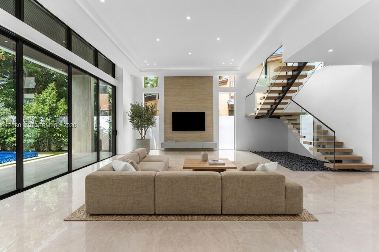 Living Room. Disclaimer: Several photographs presented in this listing contain digitally added furniture, artwork, and decor. These virtually staged images are intended solely for illustrative purposes.
