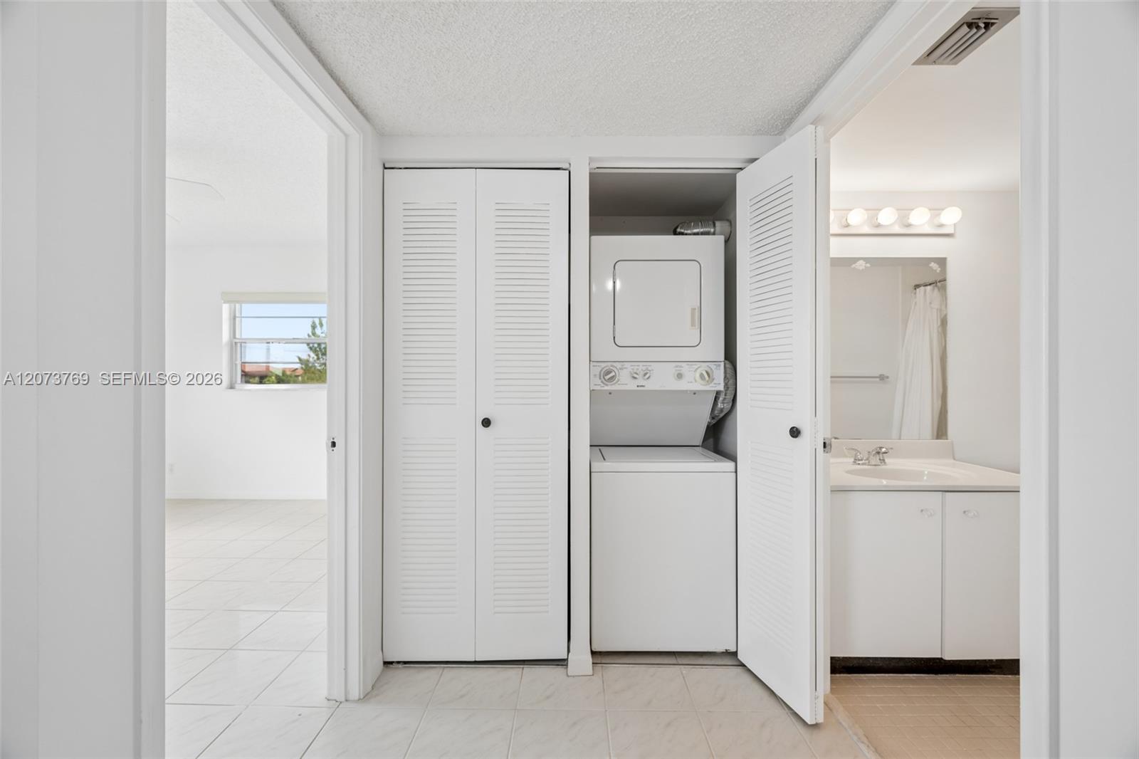 Entry and Guest Bedroom, Laundry Closet, and Guest Bedroom View