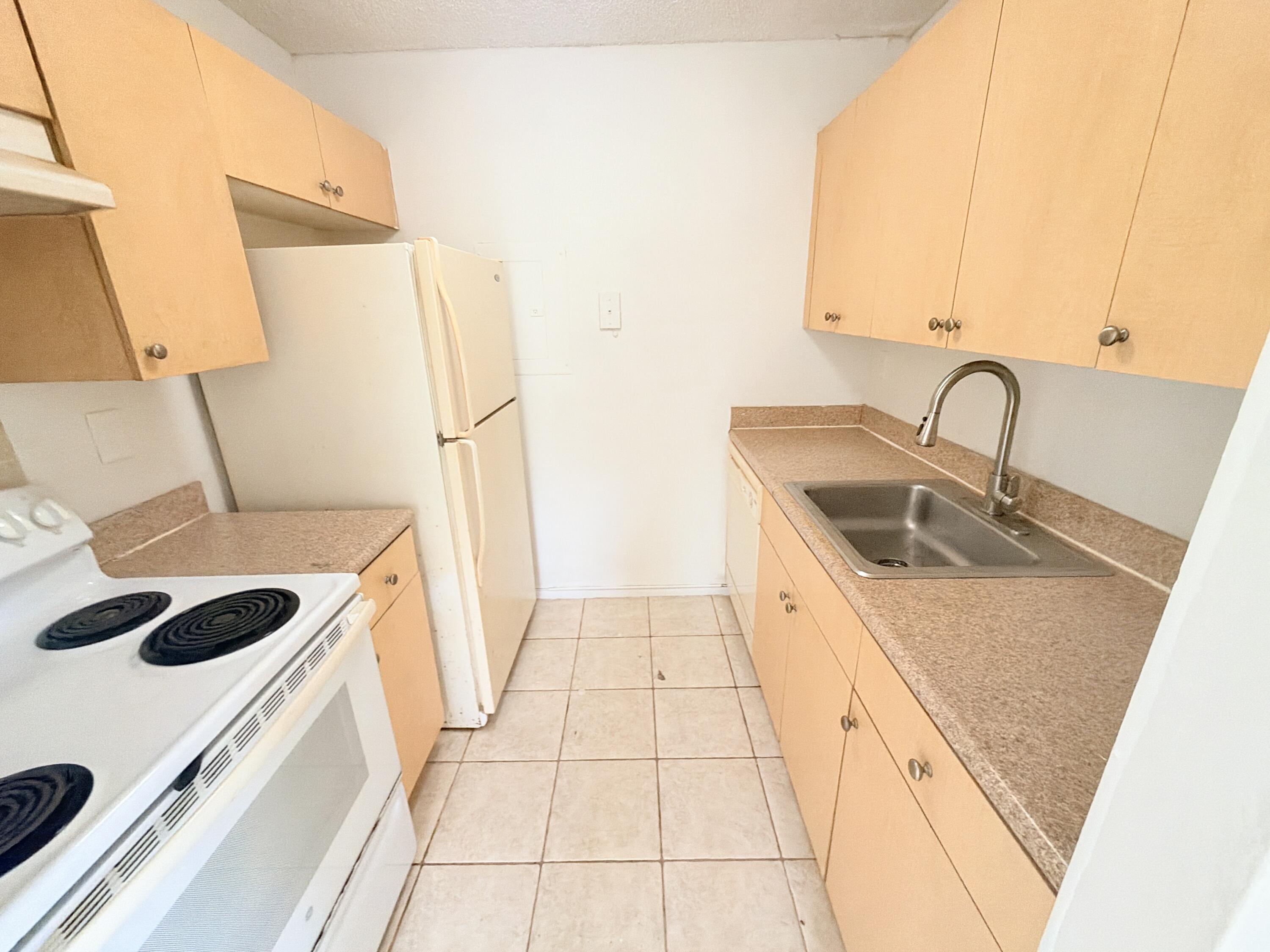 1089 N BENOIST FARMS Road # 102, West Palm Beach FL 33411