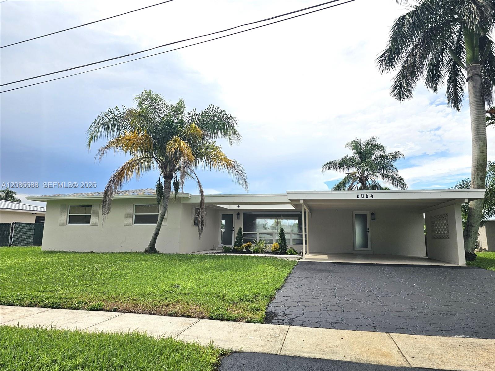 6064 NW 16th Ct — Photo 3