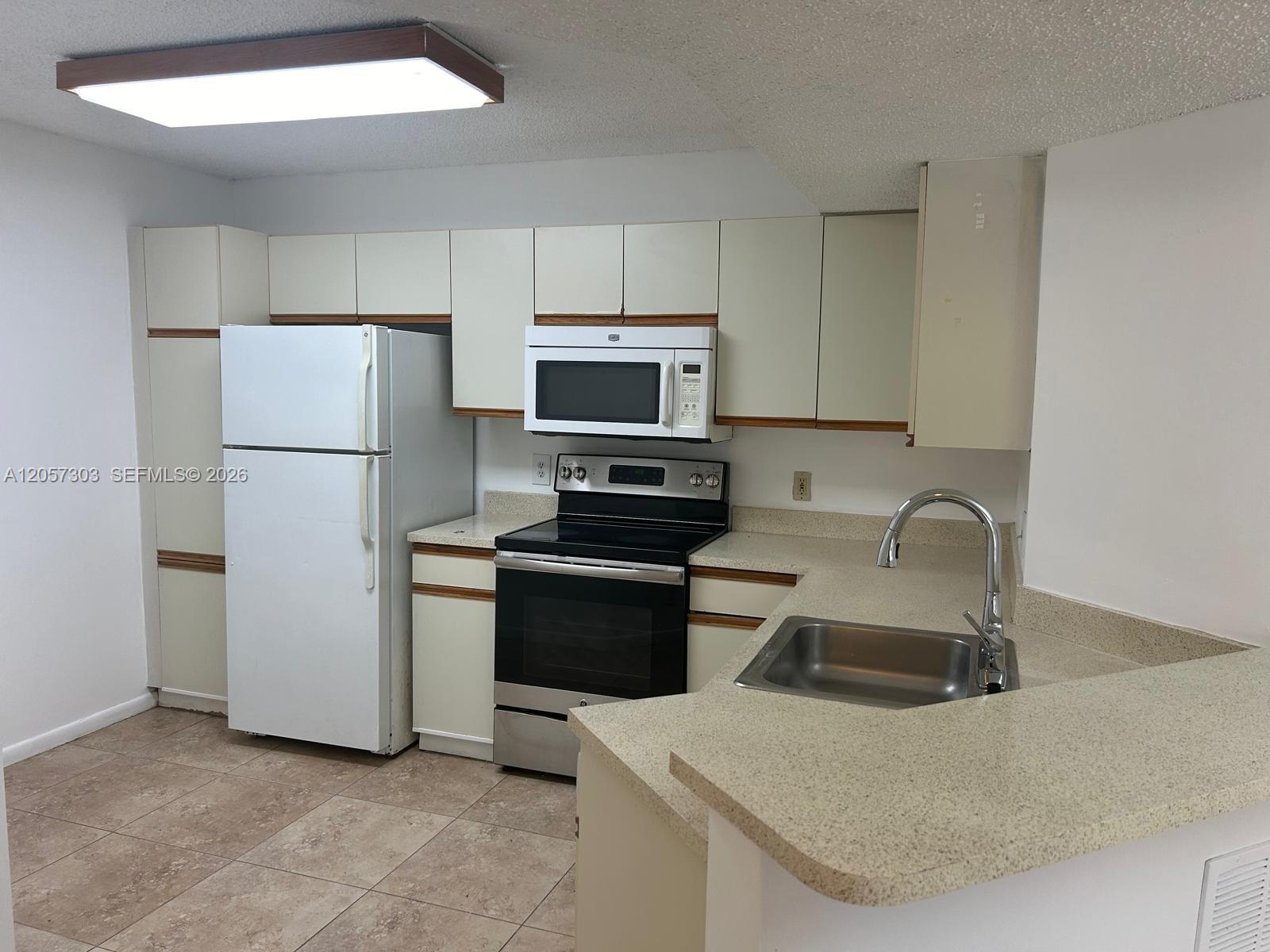8851 Wiles Rd # 208 — Photo 4