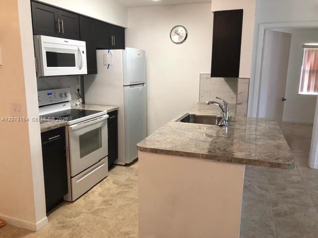 700 NW 103rd Ter # 101 — Photo 3