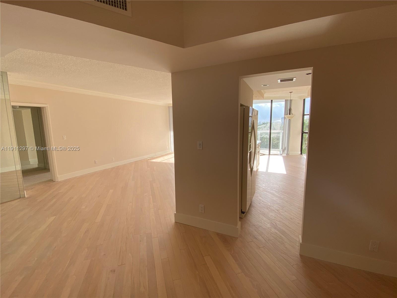 Beautiful woood floors in the spacious living area.