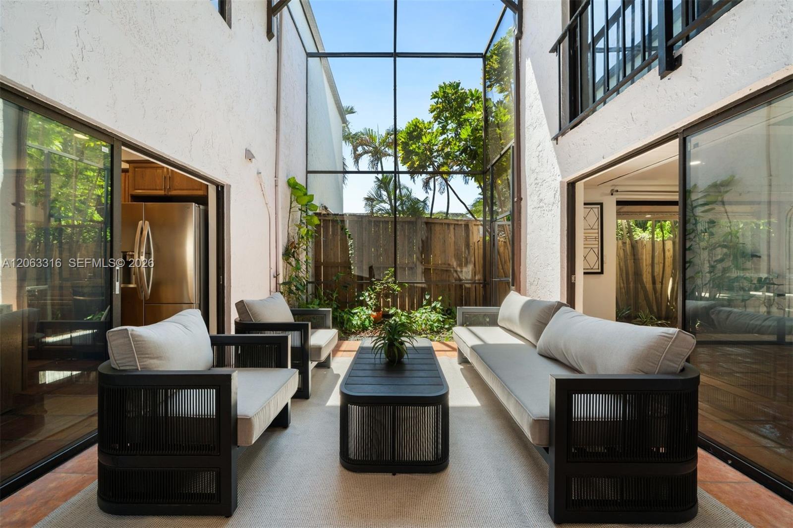 Private screened-in partially covered atrium