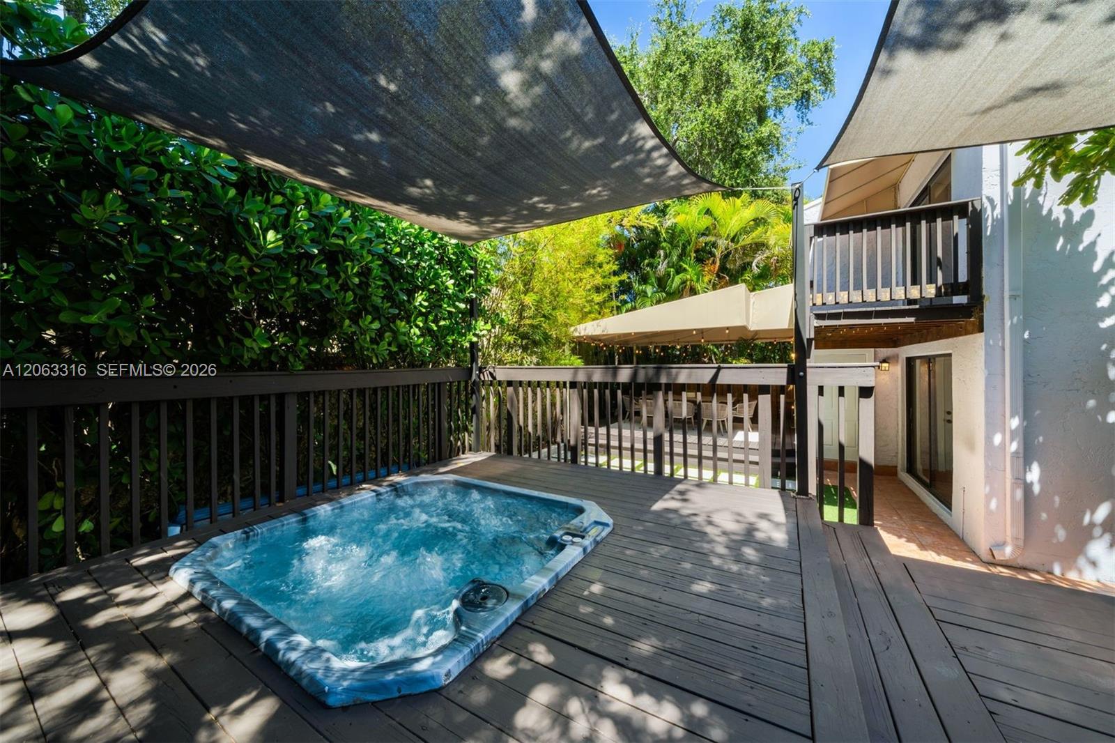 Private 50' wide backyard garden with decks & hot tub