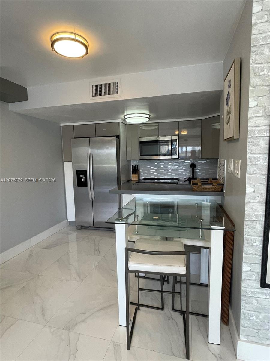 Open kitchen with table and chairs