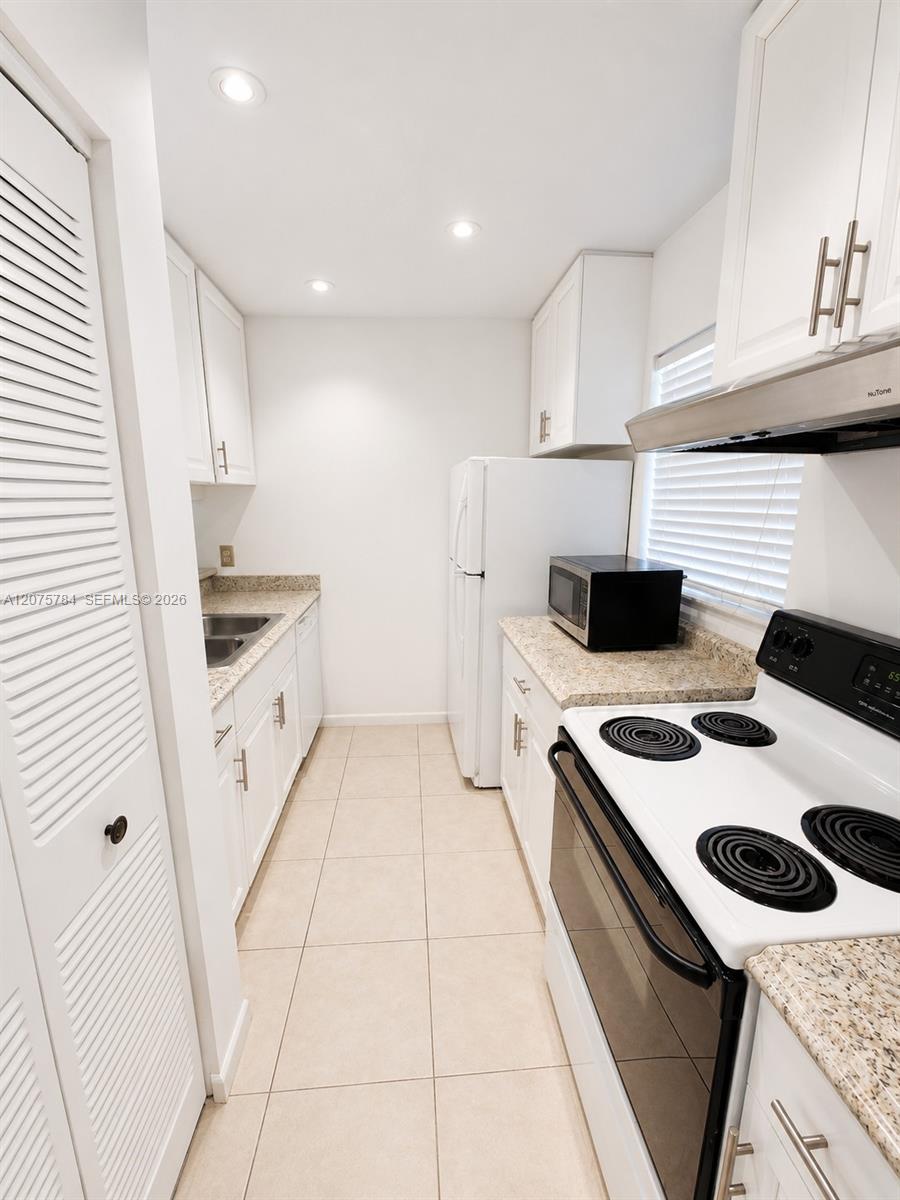Bright Kitchen with ample Cabinet Space