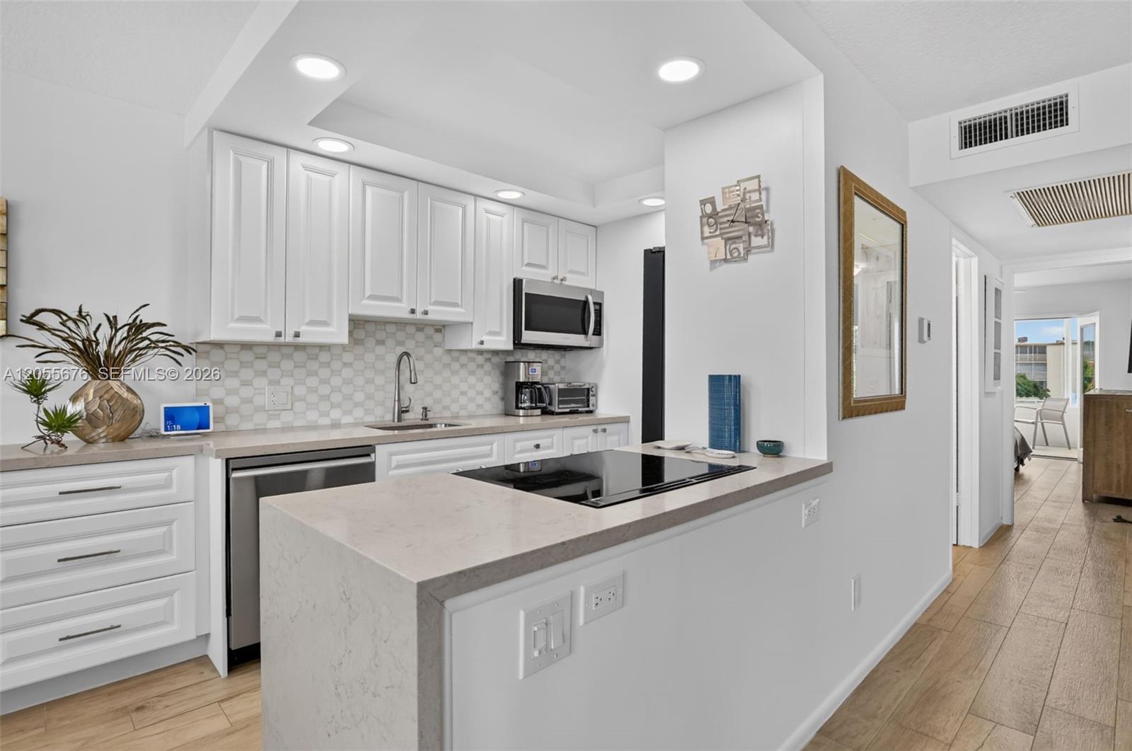 Quartzite waterfall edge completed this spectacular chef's kitchen.