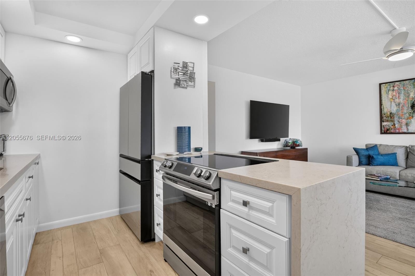 High end kitchen appliances include french door refrigerator with beverage center.