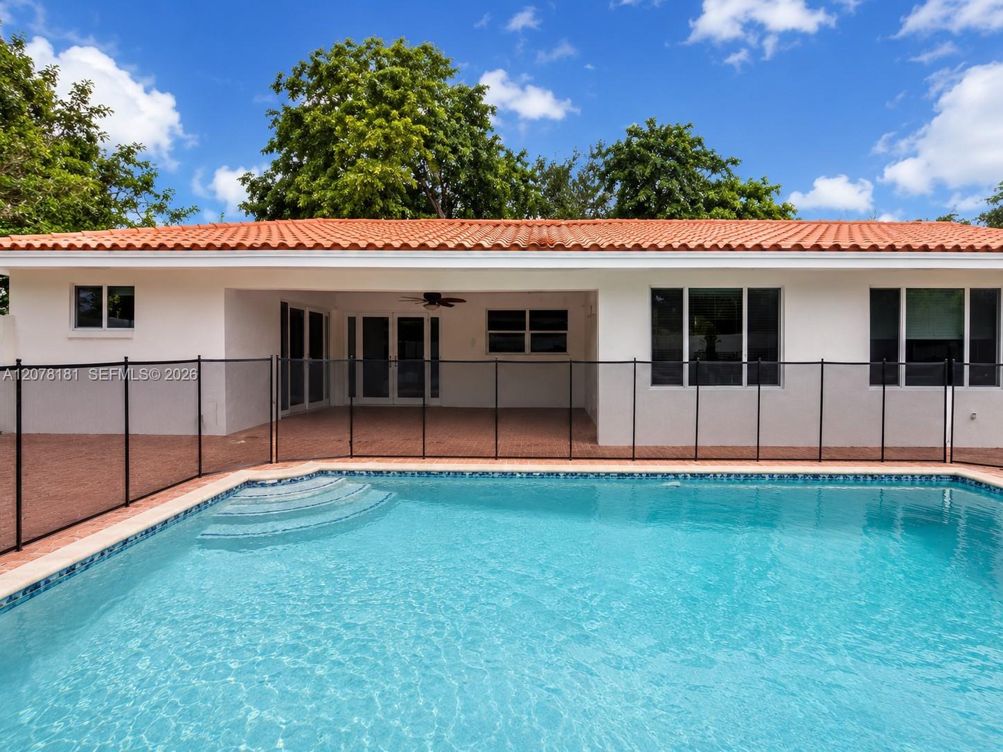 large pool with covered patio