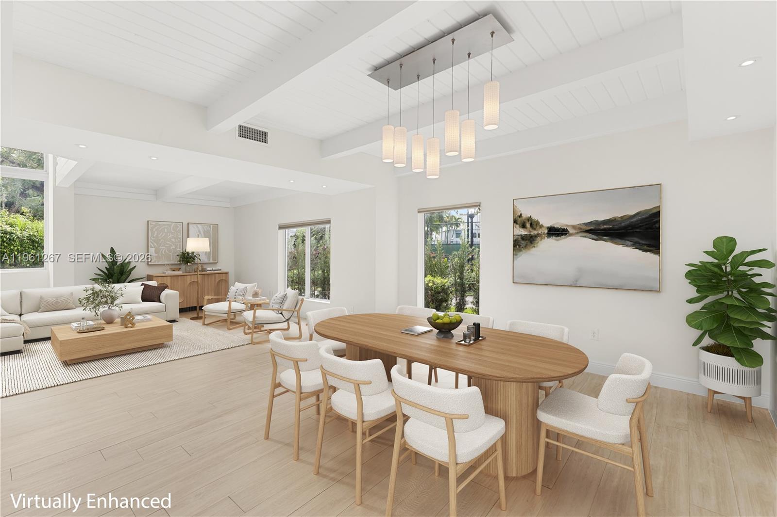 Dining Area w/ Beautiful Lighting and 2 Story Ceilings