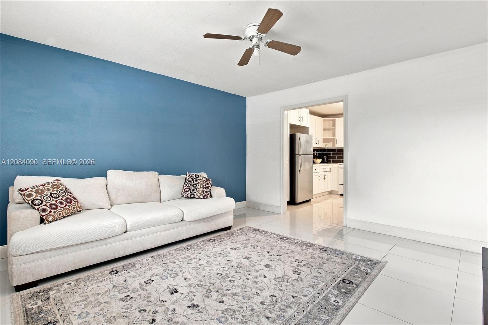 Bright and inviting living area featuring a spacious, open layout with abundant natural light