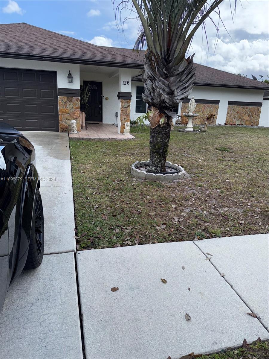 126 Sunflower Cir, Royal Palm Beach FL 33411