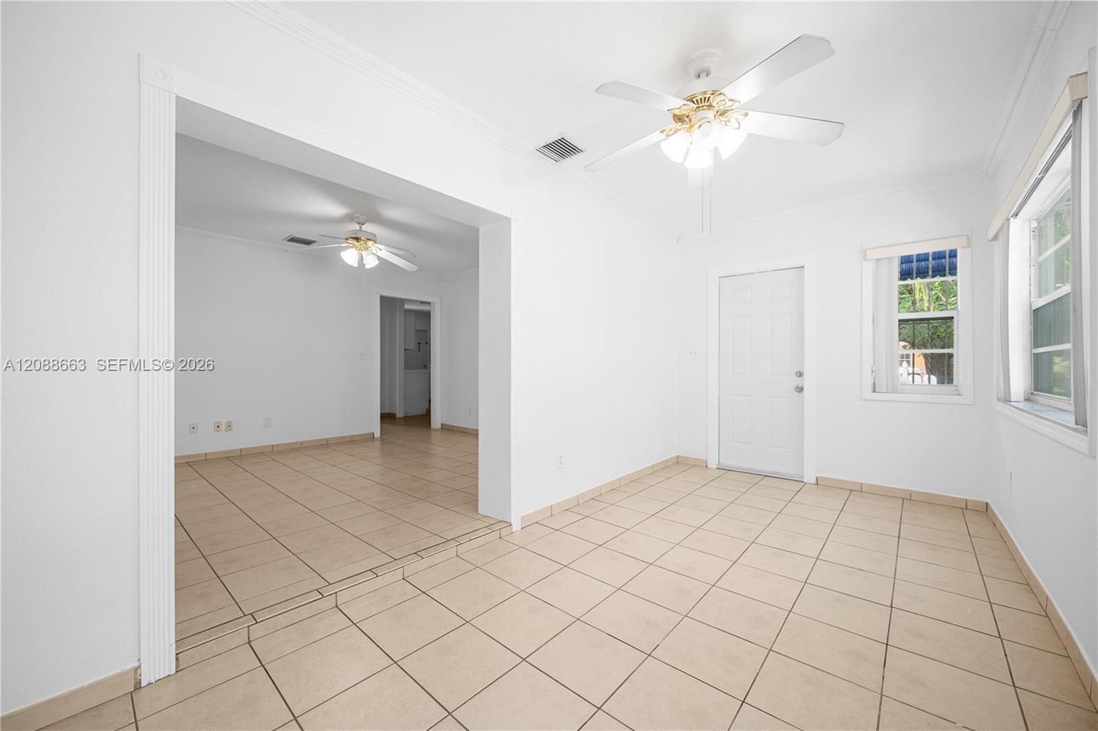 Dedicated formal dining room seamlessly connecting to the main living areas, perfect for hosting and everyday dining.