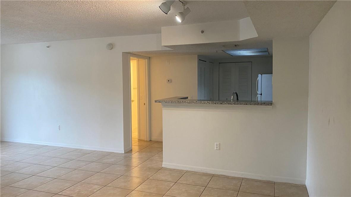 5045 WILES Road # 205 — Photo 4
