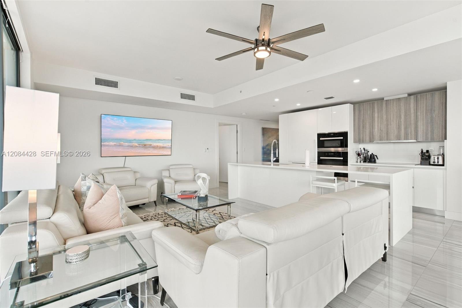 Fully furnished living area with contemporary finishes and an open layout.