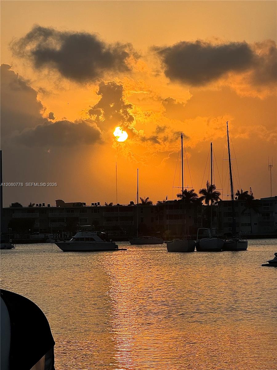 Enjoy the serenity of waterfront living with stunning panoramic views and vibrant sunsets from the comfort of your home