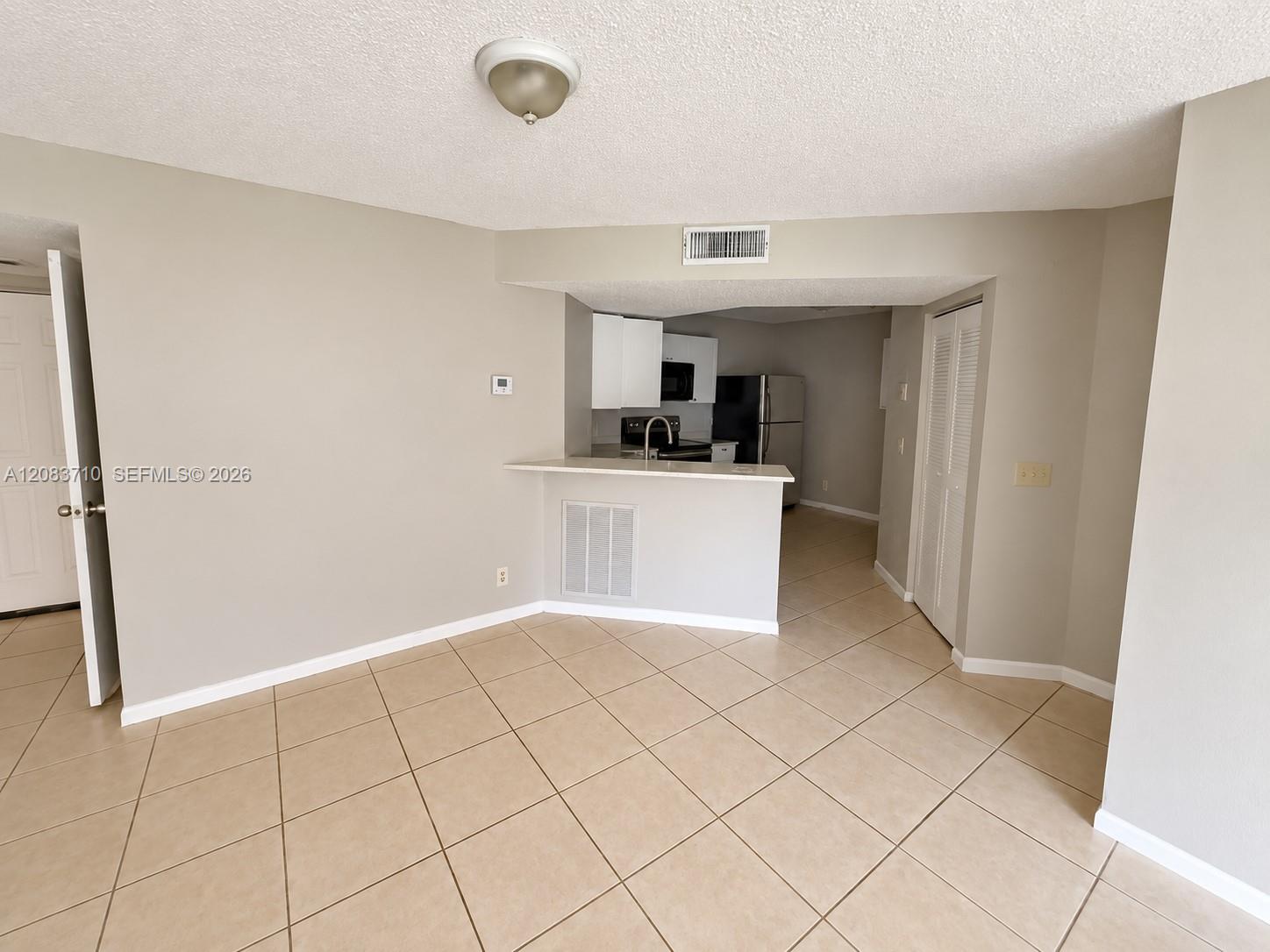 8821 Wiles Rd # 102 — Photo 3