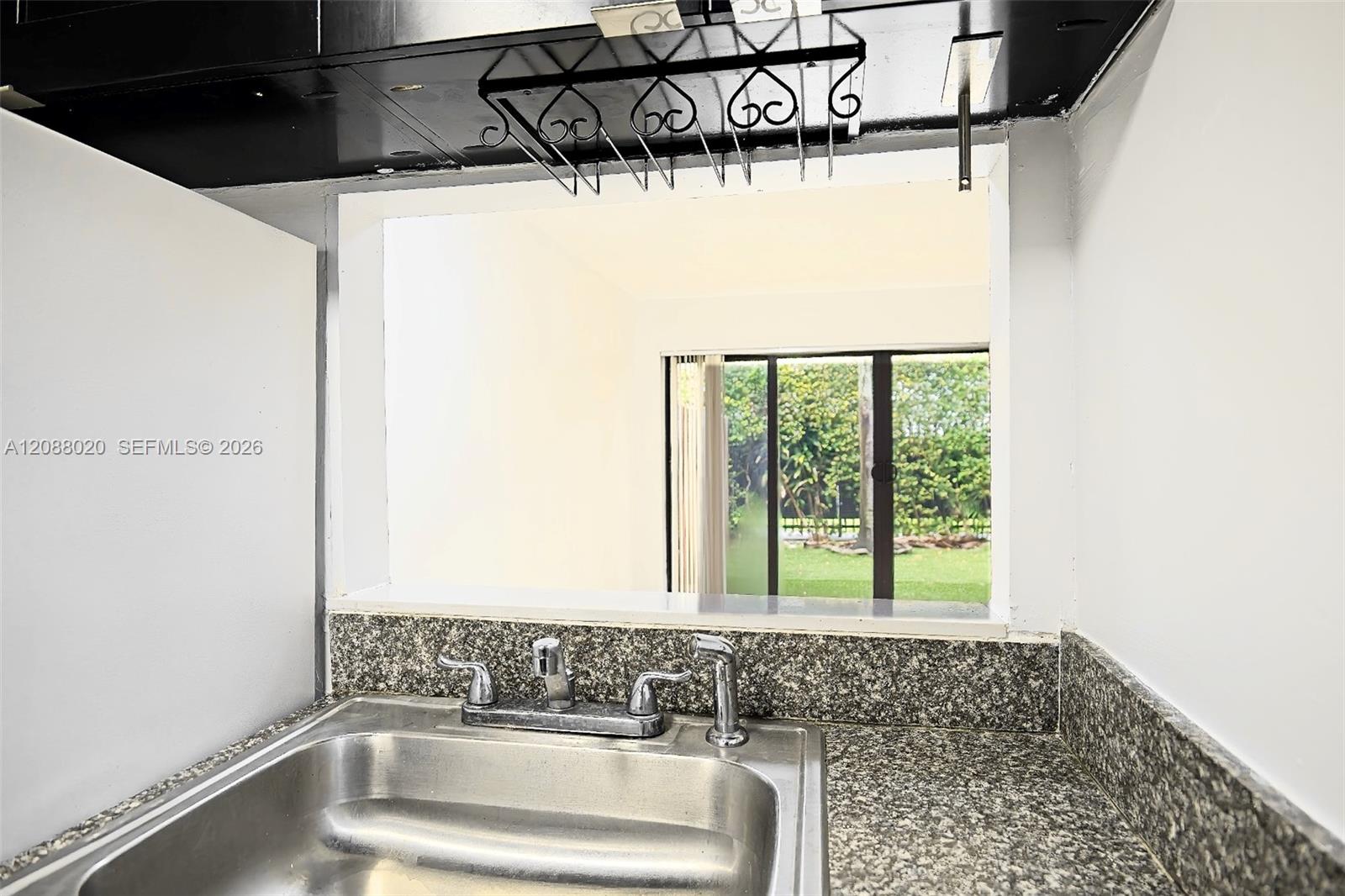 Window in kitchen allows for a nice view to backyard.