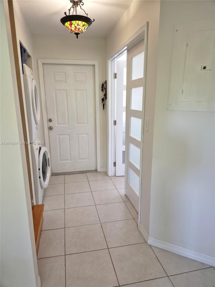 View of Laundry, Den/Bonus Room and Front Entrance
