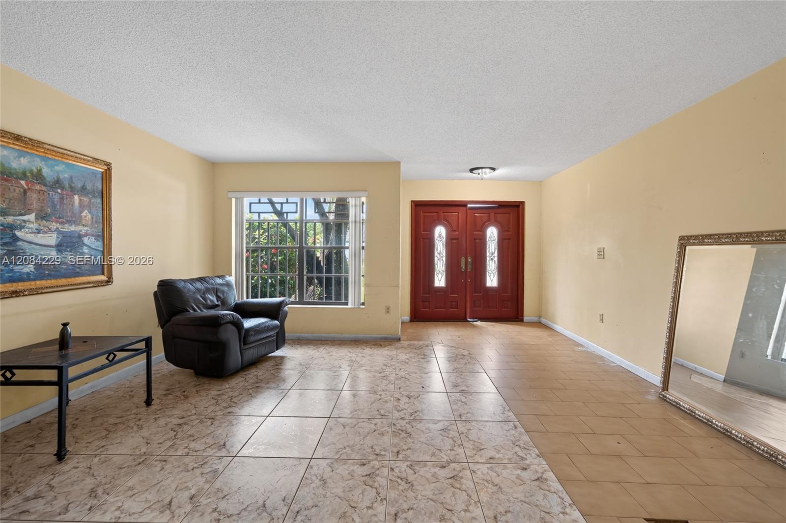View to the double front door from the living area