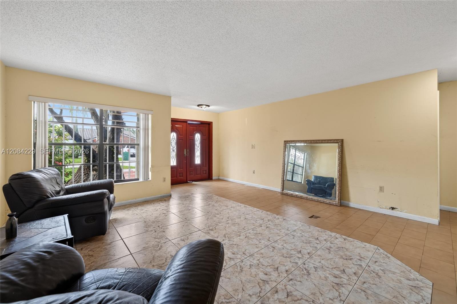 Another living room and foyer view