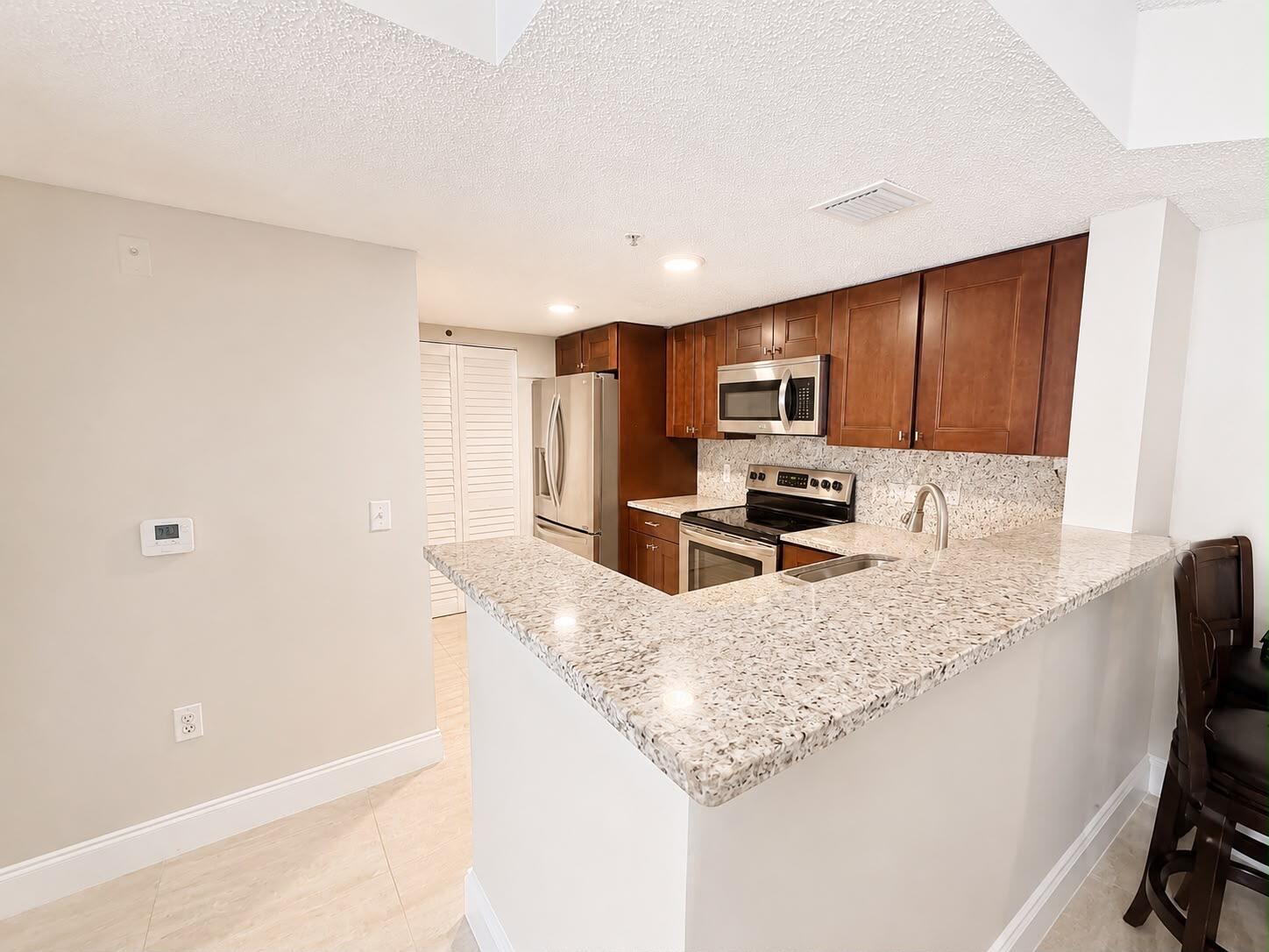 5045 Wiles Road # 105 — Photo 4