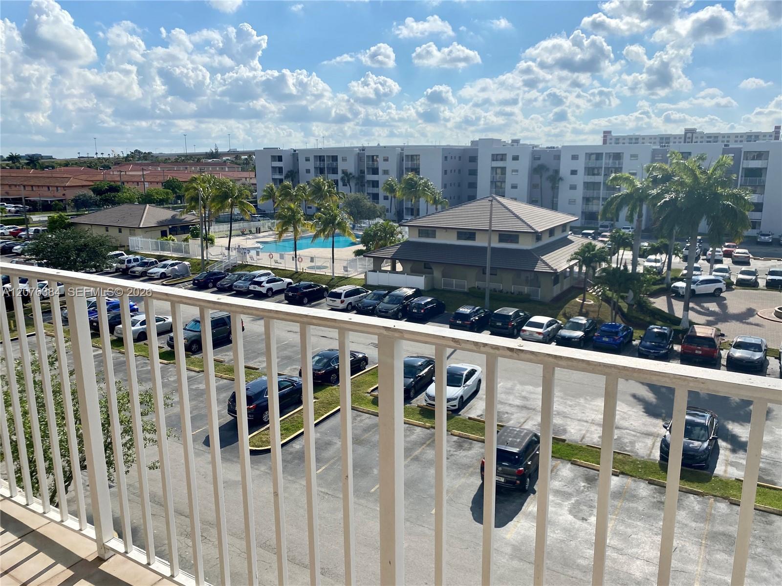 Balcony View: Pool and clubhouse