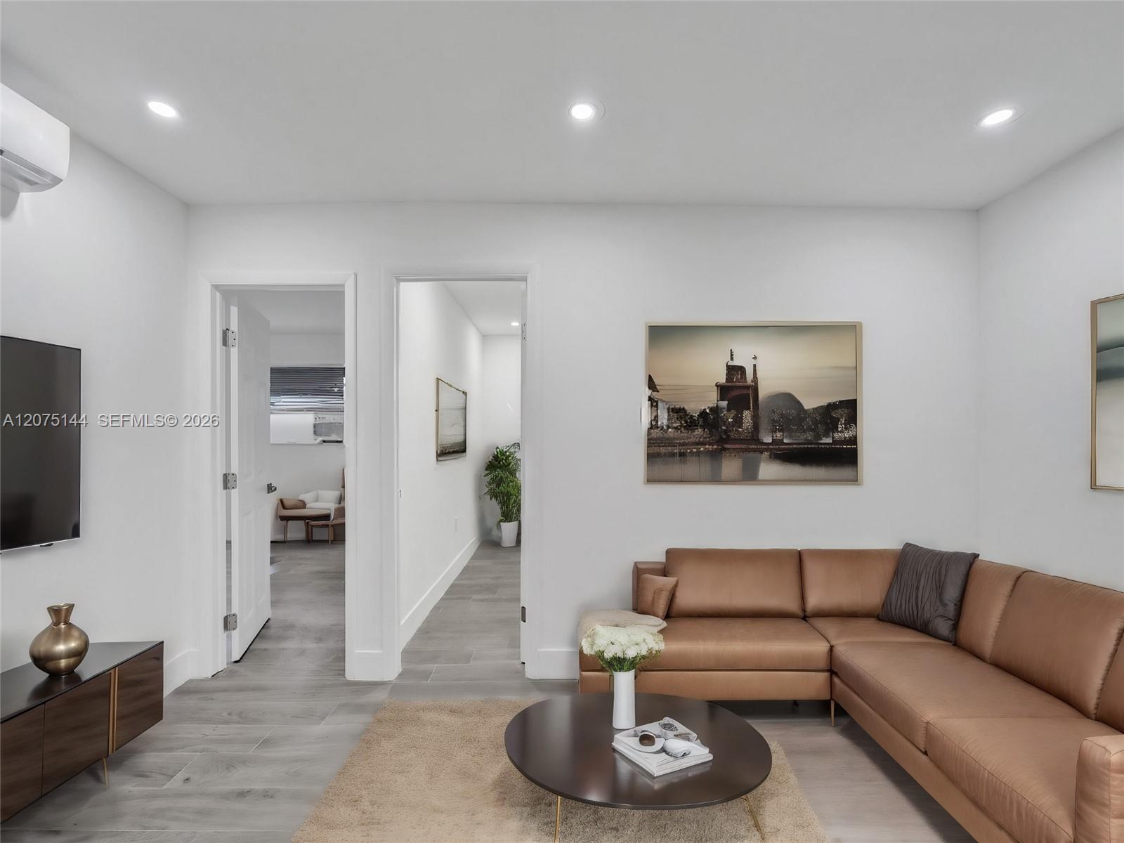 The unit is UNFURNISHED- This photo is VIRTUAL STAGED FOR VISUALIZATION