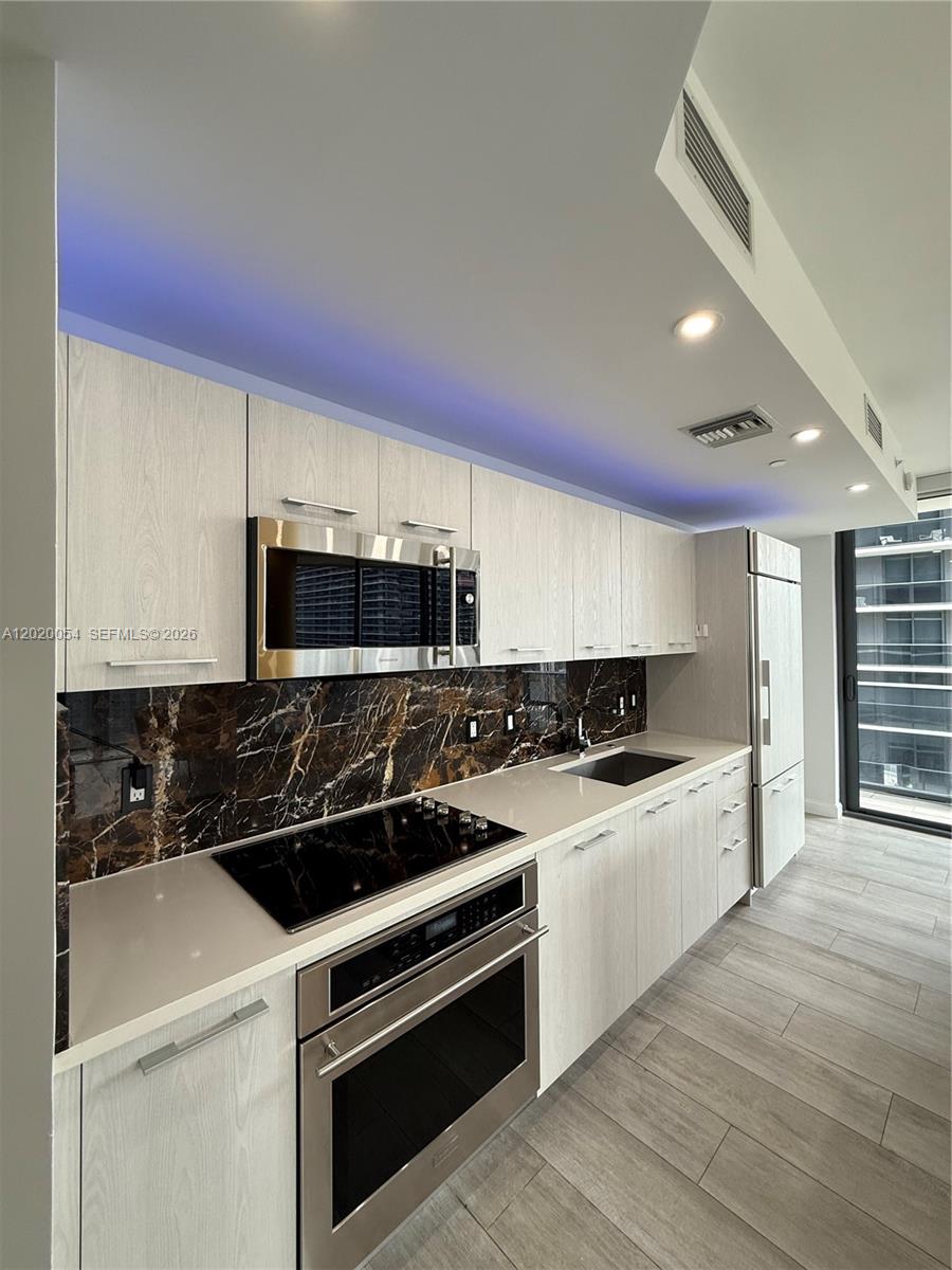 High-end Monogram appliances include: Refrigerator, Freezer, Dishwasher, Electric Range, Self-Cleaning Oven, and Microwave.